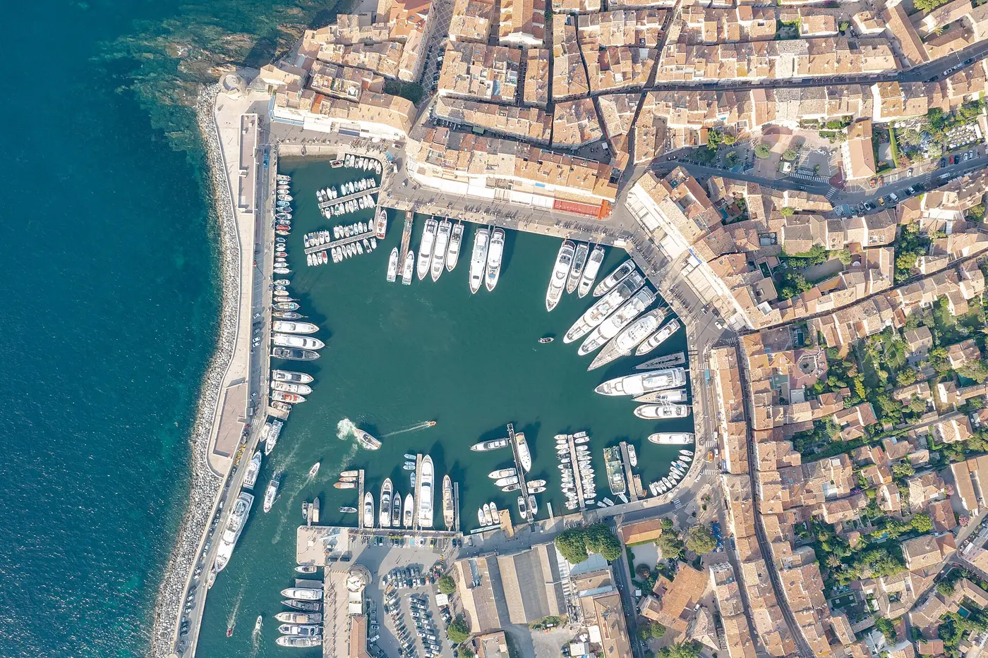 Aerial view of yachts berthed stern to the quay in an old port