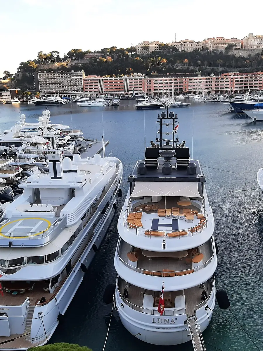 Superyacht sterns berthed side by side in Port Hercule, Monaco